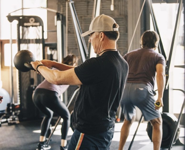Man with keettlebell at Mind Muscle Fitness